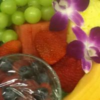Sliced Fruit · Fresh ripe melons with seasonal berries beautifully displayed with kiwi, mangoes and seedles...