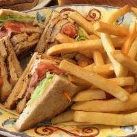 Royal Club · Turkey, bacon, lettuce and tomato on rye with Russian dressing. Served with french fries or ...
