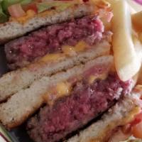 Traditional Pastrami Ruben · Pastrami on grilled rye bread with sauerkraut and melted Swiss. Served with french fries or ...
