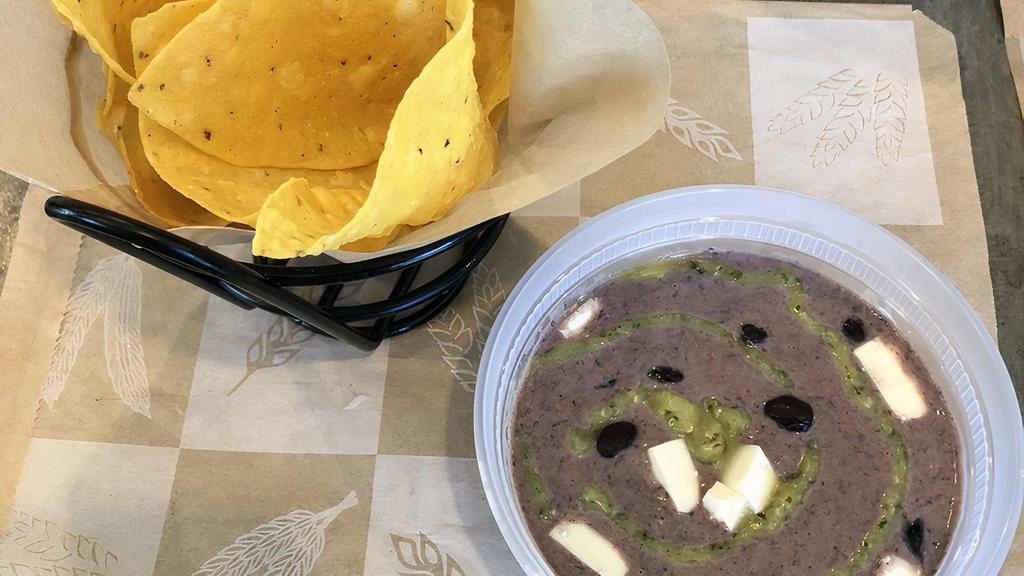 Black Bean Hummus With Tortilla Chips (Beans,Queso Fresco,Salsa Verde) (1) · Blended Black beans, tahini, and spices topped with quest fresco and salsa verde.  Gluten free