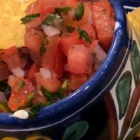 Pico De Gallo W, Tortilla Chips (1) · chopped tomatoes, red onion, serrano chiles and cilantro