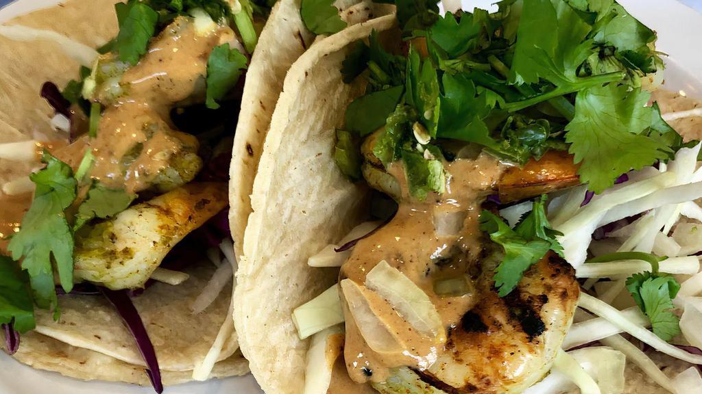 Shrimp  W/ Lentil Salad, Cabbage, Red Onions & Chipotle Tahini (1) · Choose as  a gluten free corn tortilla taco or burrito on a flour tortilla