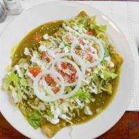 Enchiladas · Rolled corn tortillas stuffed with chopped choice of meat and sauce.