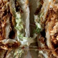 Cemita · Mexican sandwich filled with beans, mayo, tomato, avocado, onion, chipotle and quesillo and ...