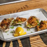 Roasted Oysters · Four Copps Island oysters roasted and topped with lemon, shallots, panko and Parmesan.