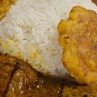 Carne Asada · Grilled steak with rice, lentils and tostones.