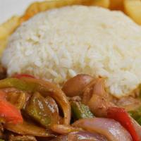 Lomito Salteado · Sautee peppers, onions and beef stripes with rice and fries.