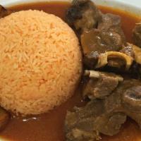 Guatita Con Seco De Chivo · Beef tripe and goat stew with rice and sweet plantain.