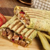 Kufta Kabob Wrap · 3 skewer of marinated beef and lamb grilled with pickles, garlic sauce, tahini sauce, lettuc...