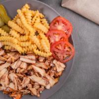 Chicken Shawarma Platter · Chicken shawarma with pickles, garlic sauce, lettuce, and tomatoes.