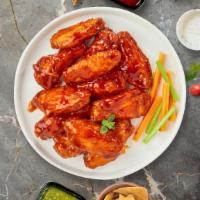 Buffy The Buffalo Chicken Wings · Fresh chicken wings breaded, fried until golden brown, and tossed in buffalo sauce. Served w...
