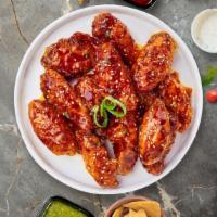 K' Cluck Wings · Fresh chicken wings breaded, fried until golden brown, and tossed in soy sauce, brown sugar,...