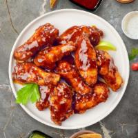 Bbq Bliss Wings · Fresh chicken wings breaded, fried until golden brown, and tossed in barbecue sauce. Served ...