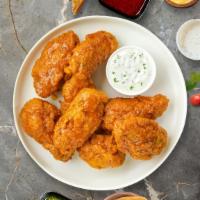 Go Go Mango Habanero Wings · Fresh chicken wings breaded, fried until golden brown, and tossed in mango habanero sauce. S...