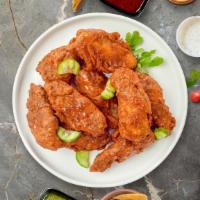 Native Nashville Hot Wings · Fresh chicken wings breaded, fried until golden brown, and tossed in Nashville Hot Sauce. Se...
