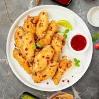 Sweet Chili Of Mine Wings · Fresh chicken wings breaded, fried until golden brown, and tossed in sweet chili sauce. Serv...