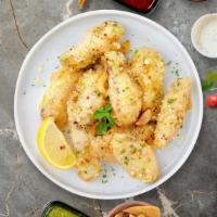 Garlic Manic Parmesan Wings · Fresh chicken wings breaded, fried until golden brown, and tossed in garlic and parmesan. Se...