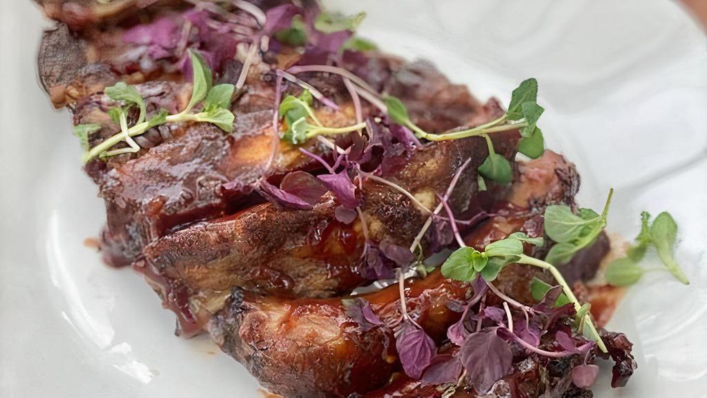 Half Rack Organic Berkshire Pork Baby Back Ribs (Gf) · Half a rack of succulents baby back ribs seasoned with our Aussie BBQ spices and finished with our yuzu kosho for the perfect balance of savory heat and sweet. (Gluten free)