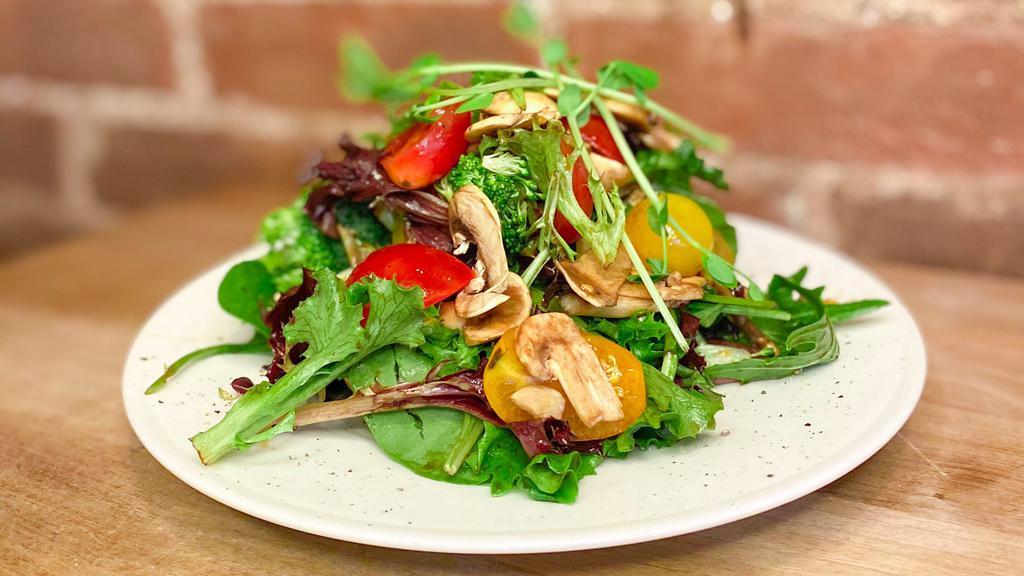 Farmers Market Salad · Mixed local baby lettuces, Blackhorse Farm heirloom cherry tomatoes, broccoli, and local mushrooms. Your choice of homemade dressing on the side: Rooftop honey & mustard, Ranch, or Balsamic and Extra Virgin Olive Oil.