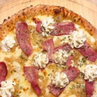 Smoked Duck Breast Pizza · Smoked Hudson Valley duck breast, aged mozzarella, ricotta, thyme, caramelized onions, extra...