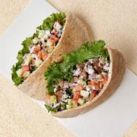 Chicken Shawarma Pita Sandwich · Wrapped in a pita with cucumber, tomato, and your choice of sauce.