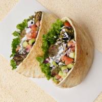 Koobideh Pita Sandwich · Wrapped in a pita with cucumber, tomato, and your choice of sauce.