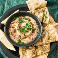 Hummus & Pita · chickpea spread made with tahini & topped with olive oil. Served with a pita bread on the si...