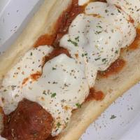 Meatball Parm Hero · Meatballs with sauce an mozzarella on a large hero!  This is a stand alone item with no sides