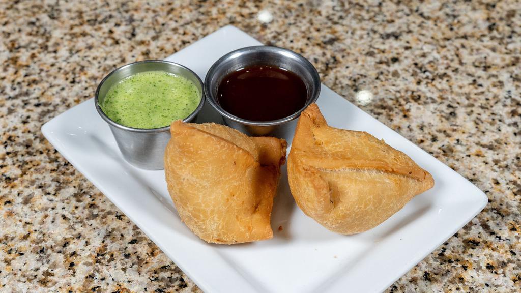 Samosa · Vegetarian. Homemade patties stuffed with potatoes and green peas along with Indian spices.