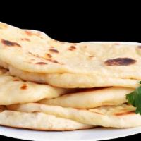 Plain Naan · Freshly made wheat flat bread baked in traditional tandoori oven.