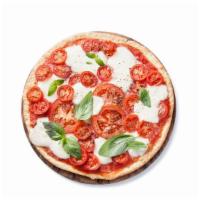 Caprese Pie Pizza · Delicious juicy caprese pie topped on a bed of mozzarella cheese.