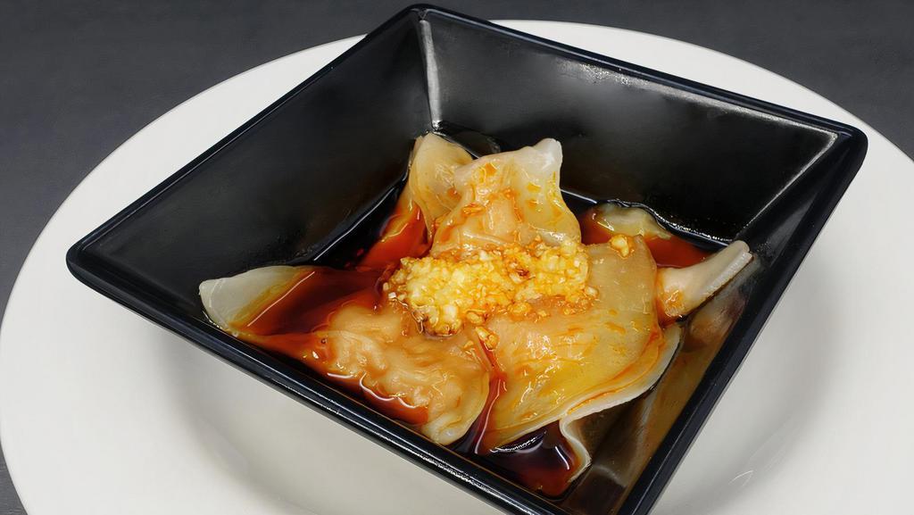 Sichuan Pork Dumpling With Roasted Red Oil红油水饺 · Hot and spicy.