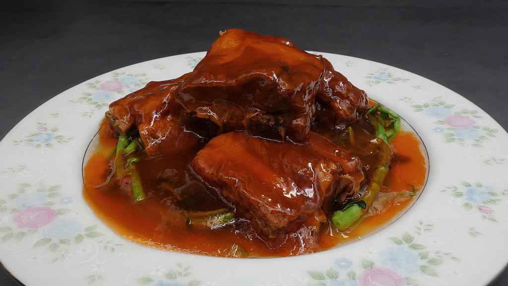 Pork Ribs With Sweet Red Wine Sauce 桂花排骨 · Baby pork ribs simmered in sweet red wine sauce.