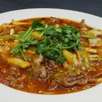 Braised Beef & Napa Cabbage In Chili Oil Sauce 水煮牛肉 · Hot and spicy. Braised sliced beef with Napa cabbage, celery and bamboo shoot in roasted chi...