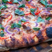 Fennel Sausage Pizza · Mozzarella cheese, red onions, fresh basil, and chili flakes.