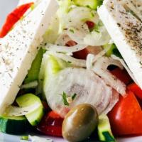 Greek Salad · Tomato, Cucumber, Red Onion, Green Pepper, Olives, Capers, Feta Cheese, EVOO