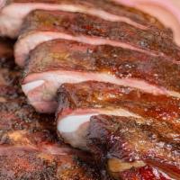 Louis Ribs - Half Rack · St. Louis-cut pork spare ribs coated in our house dry rub and smoked for several hours befor...