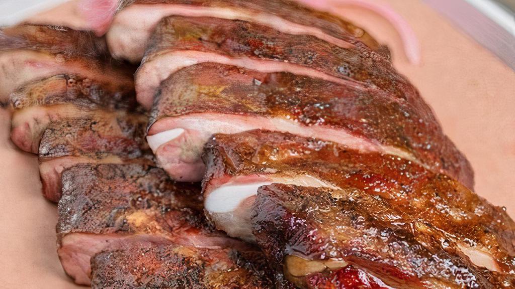 Louis Ribs - Half Rack · St. Louis-cut pork spare ribs coated in our house dry rub and smoked for several hours before being basted in Mutiny’s signature BBQ sauce.