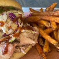 Pulled Pork Sandwich · Our Eastern Carolina style pulled pork piled high on a huge 