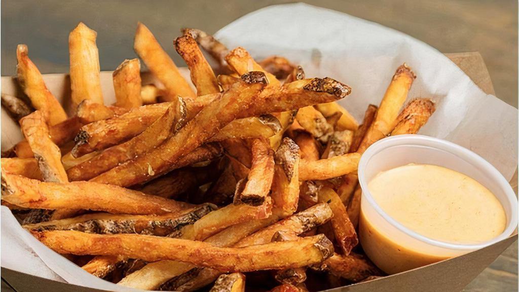 Fries · Our hand cut Austin fries are a specialty of the house. Tossed in a secret “magic”. seasoning. Servred with a side of our Mutiny Sauce,  a Cajun Dijon aioli.