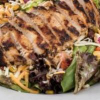 Grilled Chicken Salad · Grilled chicken breast on top of mixed greens and tomato.