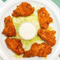Buffalo Wings (7) · Chicken wings are breaded and fried then tossed in buffalo sauce.