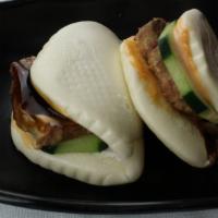 Cha Shu Bun (2) · Steamed bun with soy braised pork belly, cucumber, mayo and chef special sauce.