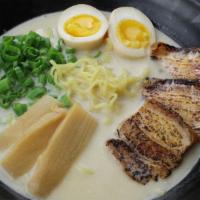Classic Tonkotsu Ramen · 10 hour slow simmered savory pork broth, chashu, soy marinated egg, scallion and bamboo shoo...