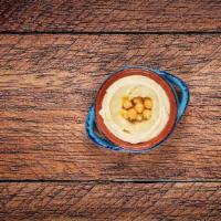 Hummus · Blended chickpeas, tahini and freshly squeezed lemon juice topped with virgin olive oil. Add...