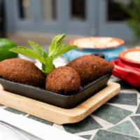 Kebbeh · 3 meat and bulgur shells stuffed with a meat filling.