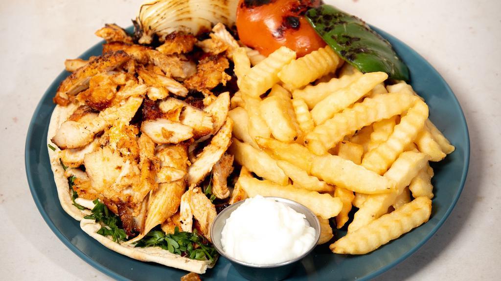 Chicken / Lamb Shawarma · Thinly sliced cuts of your choice of chicken or lamb.