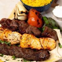 Mixed Grill Platter · One skewer of grilled veal filet, one skewer of taouk and two skewers of kabab halabi.