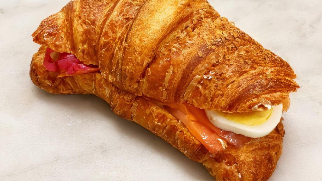 Smoked Salmon  · Whole  wheat croissant filled with hard boiled organic egg, fine herbs, fromage blanc and pickled onions.