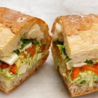 Chicken Salad Sandwich · Roasted chicken with arugula, roasted red peppers, and ricotta salata on a ciabatta roll.